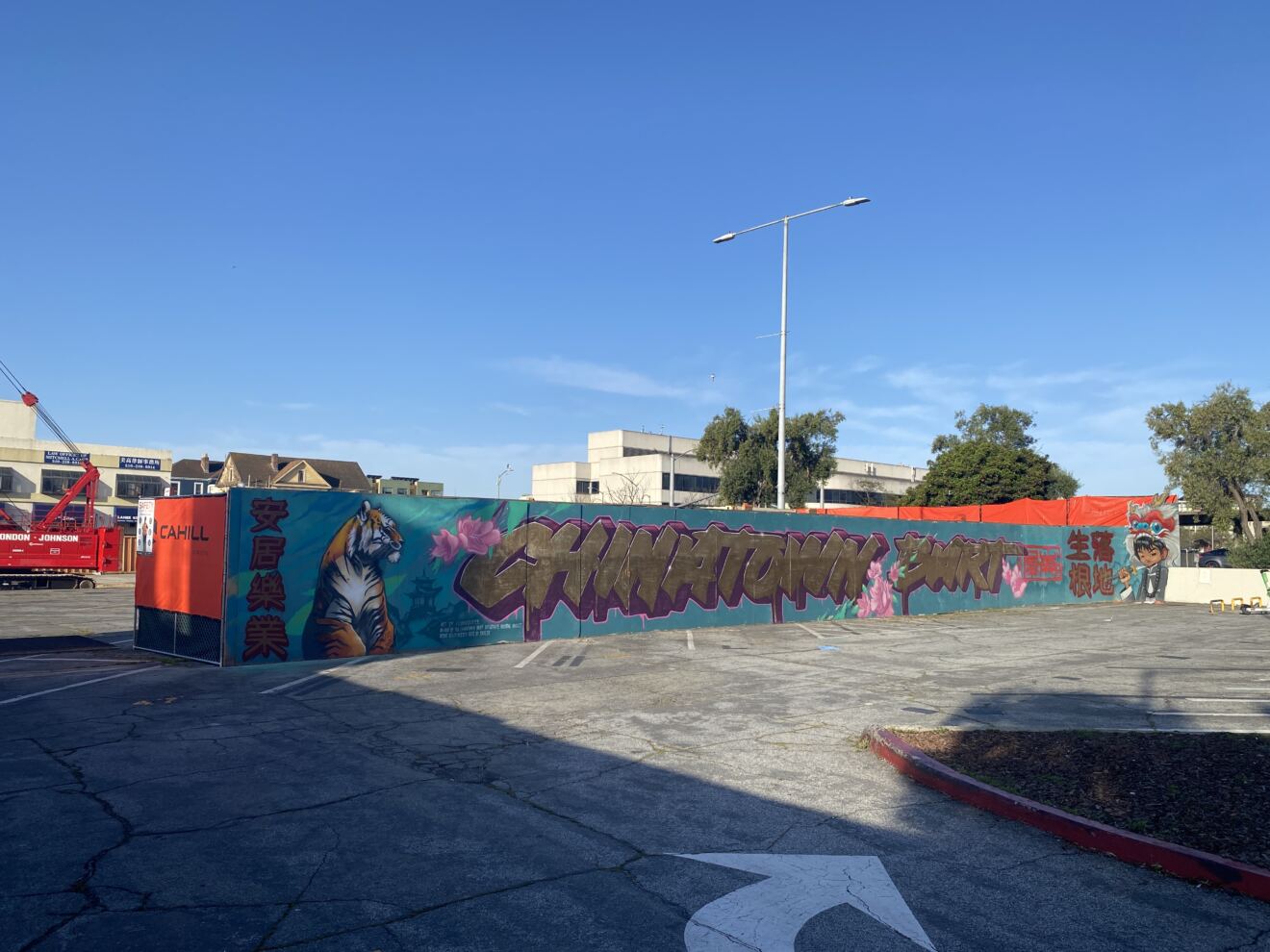Large-Scale Mural Project Adorns Oakland Chinatown TOD Construction Fences